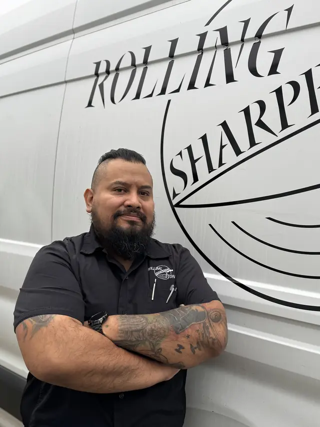 Alberto, manager at Rolling Sharpening Stone, at a sharpening truck