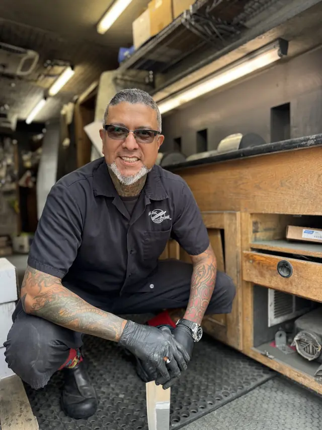 Joey inside a Rolling Sharpening Stone sharpening truck